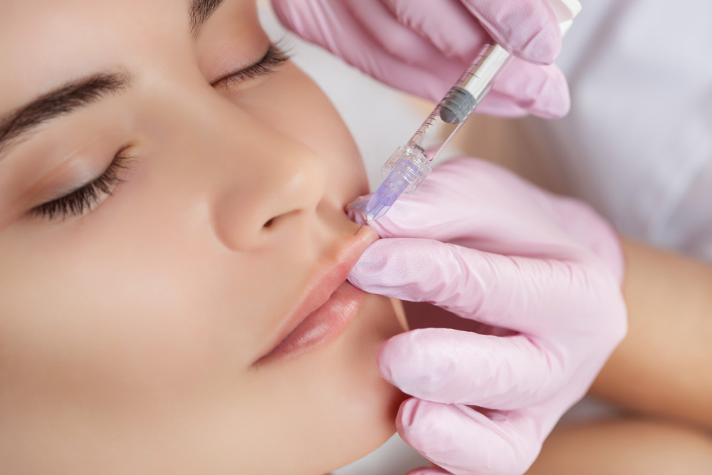 Dermal Fillers Wrinkle Treatment: A picture of a woman woman having the treatment.